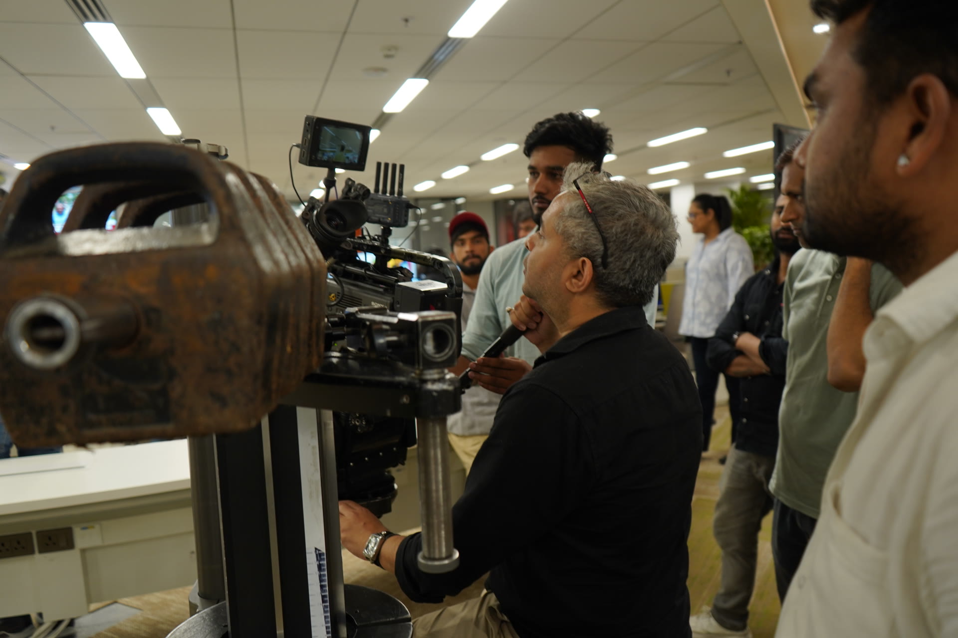 Director reviewing camera monitor on set