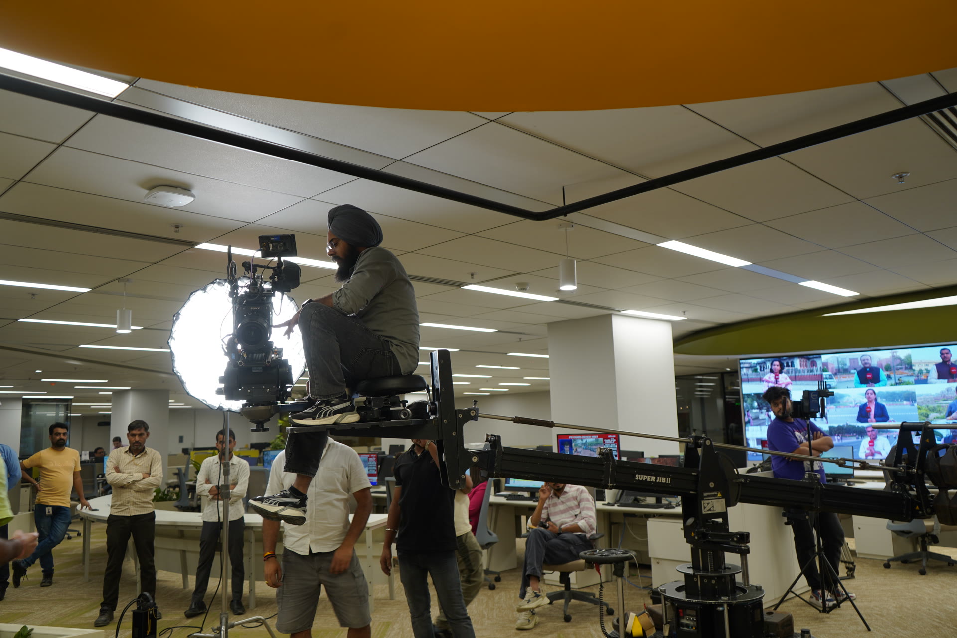 Cinematographer operating Super Jib in NDTV newsroom